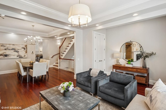 living area with a chandelier, stairs, dark wood-style floors, baseboards, and crown molding