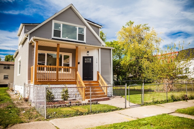 118 W 118th St, Chicago, IL 60628 - bungalow with a porch and a gate
