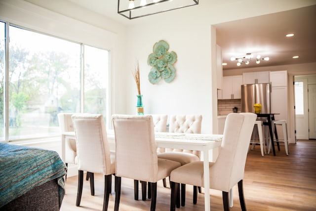 118 W 118th St, Chicago, IL 60628 - dining room with light wood-style floors and recessed lighting