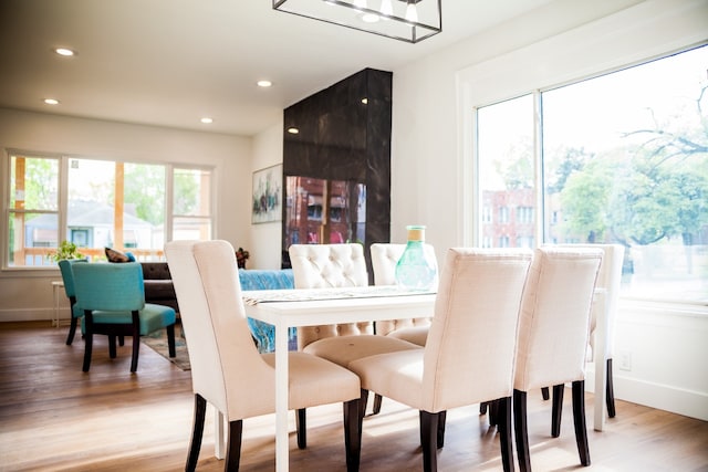 118 W 118th St, Chicago, IL 60628 - dining space featuring recessed lighting, wood finished floors, and baseboards