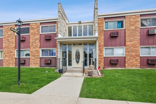 1313B S Rebecca Rd Unit 215, Lombard, IL 60148 - view of property featuring a wall mounted AC and cooling unit