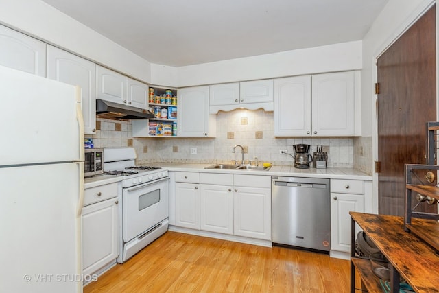 1313B S Rebecca Rd Unit 215, Lombard, IL 60148 - kitchen with stainless steel appliances, a sink, under cabinet range hood, light countertops, and white cabinetry