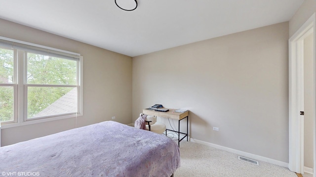 bedroom featuring carpet flooring and baseboards