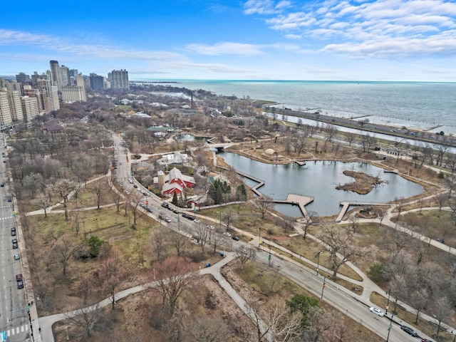 view of property location featuring a nearby body of water and nearby urban area