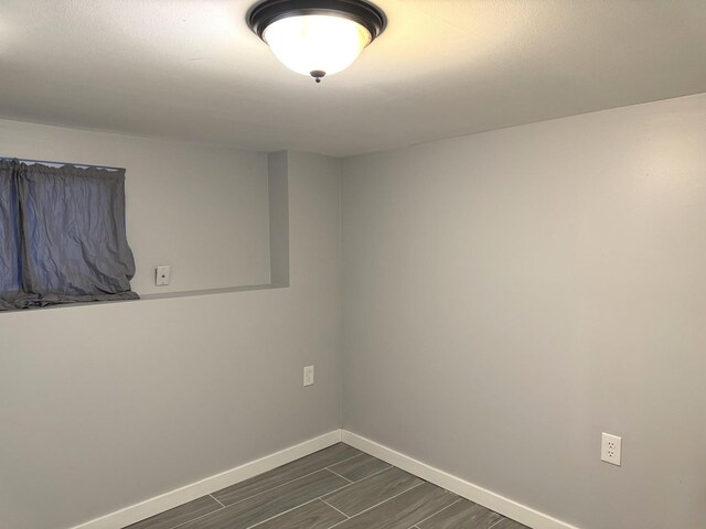 5343 W Warwick Ave, Chicago, IL 60641 - empty room featuring baseboards and dark wood-style floors