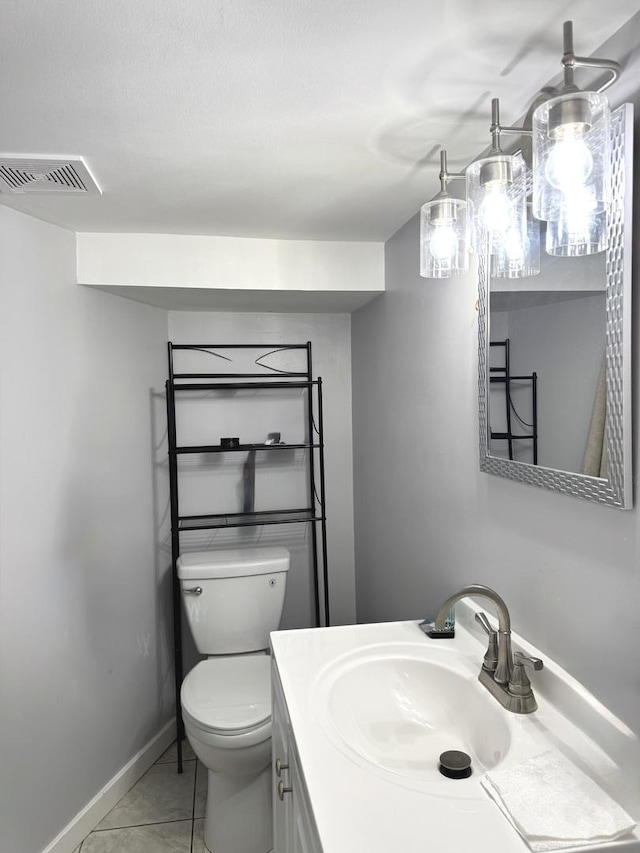 5343 W Warwick Ave, Chicago, IL 60641 - half bath featuring tile patterned flooring, toilet, vanity, and baseboards