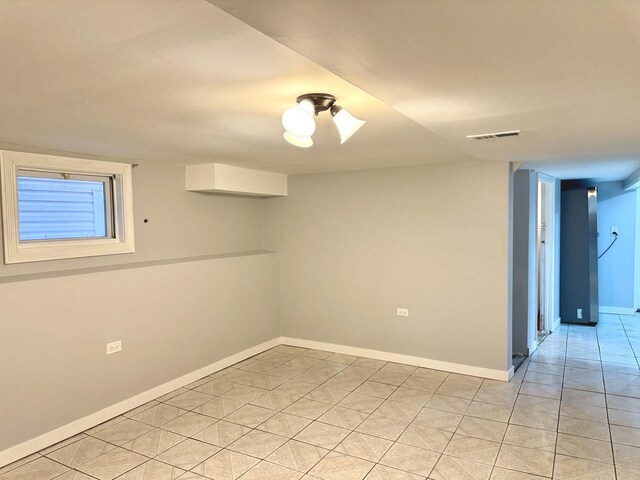 5343 W Warwick Ave, Chicago, IL 60641 - spare room featuring baseboards and light tile patterned floors