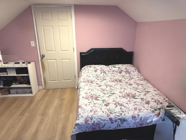 5343 W Warwick Ave, Chicago, IL 60641 - bedroom with light wood-style floors and vaulted ceiling