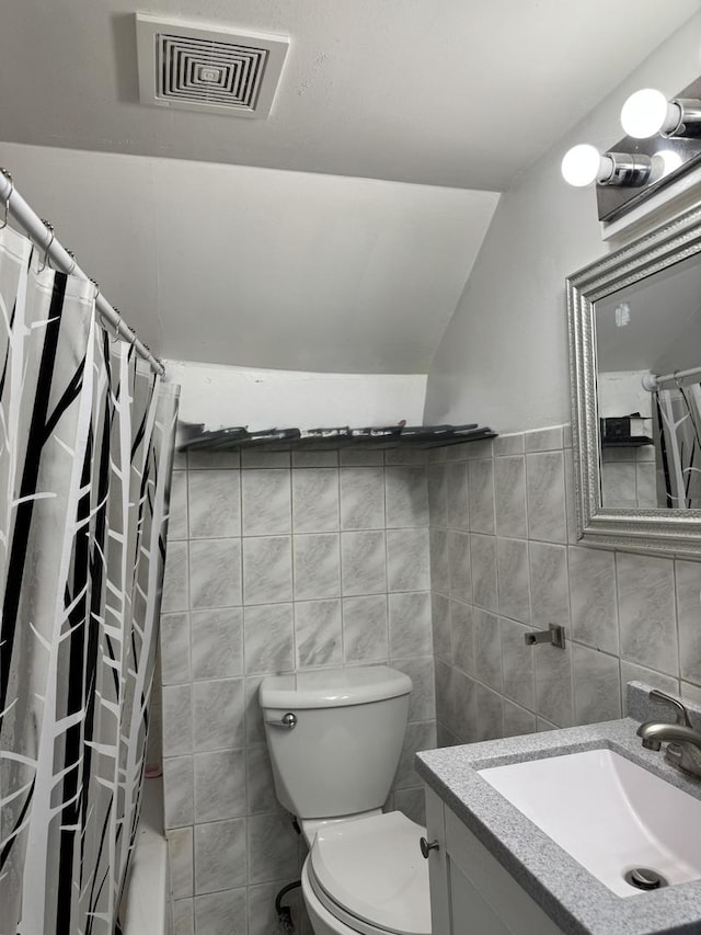 5343 W Warwick Ave, Chicago, IL 60641 - full bathroom featuring toilet, tile walls, vanity, a shower with curtain, and lofted ceiling