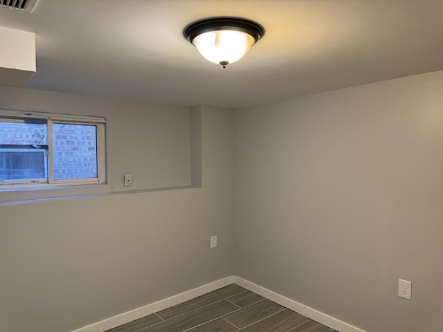 5343 W Warwick Ave, Chicago, IL 60641 - unfurnished room featuring baseboards and wood tiled floors