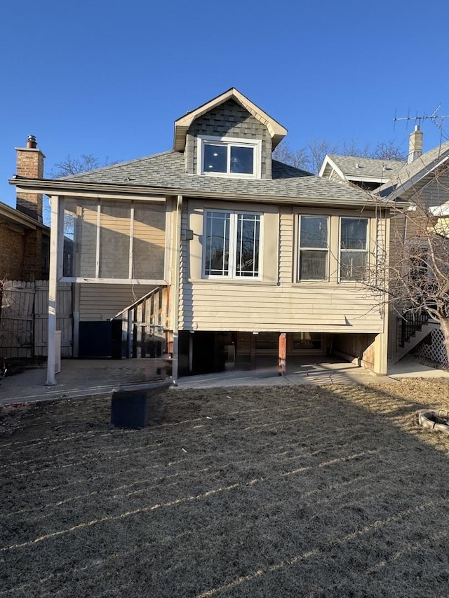 5343 W Warwick Ave, Chicago, IL 60641 - rear view of property with roof with shingles, fence, and a patio area
