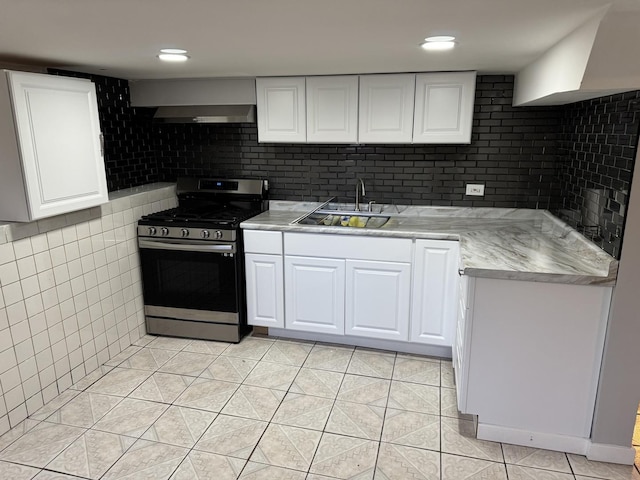 5343 W Warwick Ave, Chicago, IL 60641 - kitchen featuring stainless steel gas range, a sink, light tile patterned floors, and light countertops