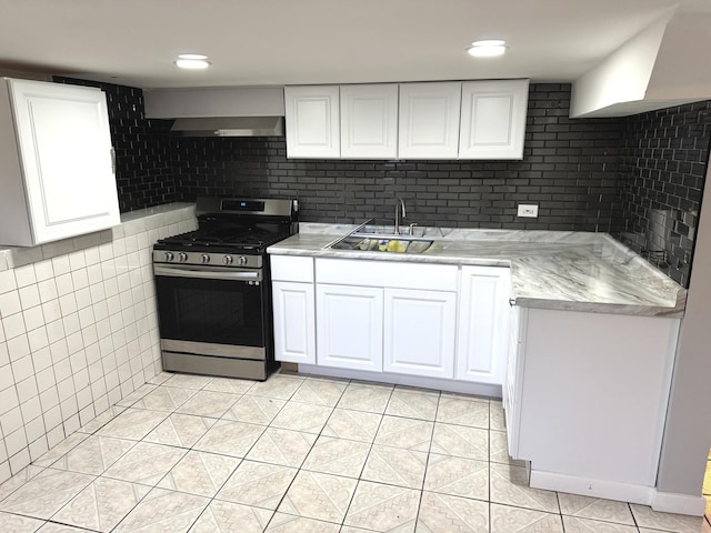 5343 W Warwick Ave, Chicago, IL 60641 - kitchen with stainless steel gas stove, a sink, light tile patterned floors, and white cabinetry