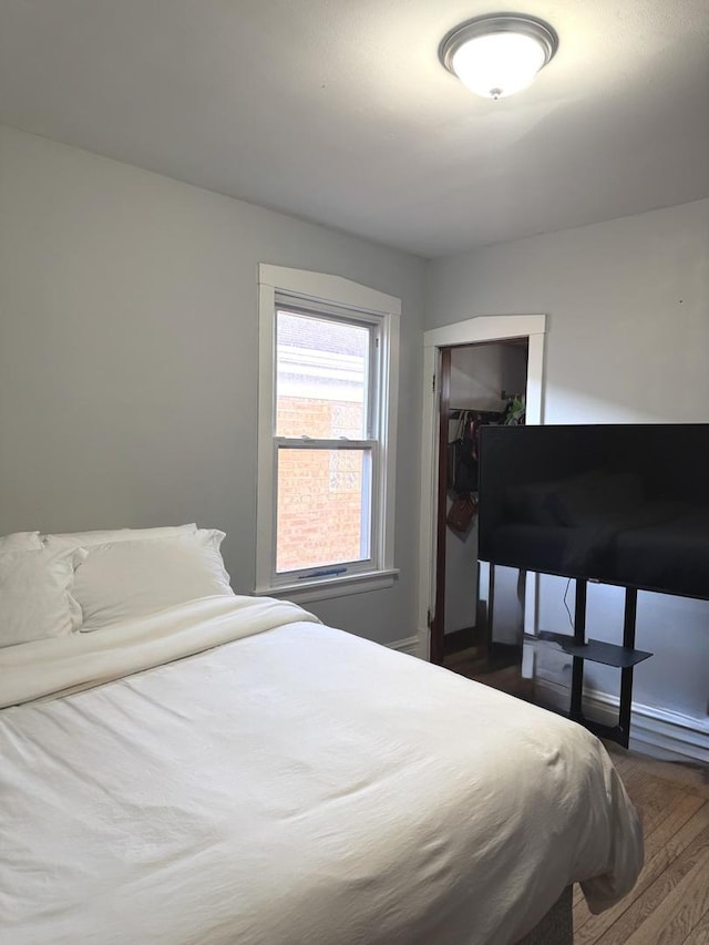 5343 W Warwick Ave, Chicago, IL 60641 - bedroom with dark wood-type flooring and a closet