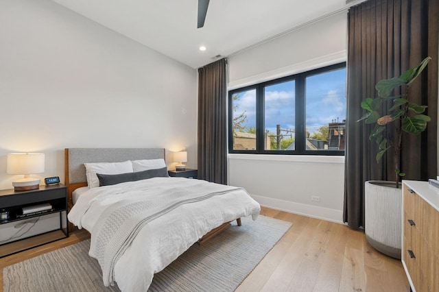 bedroom featuring light wood-type flooring, recessed lighting, baseboards, and ceiling fan