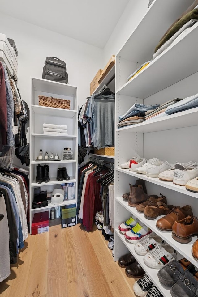 spacious closet with wood finished floors