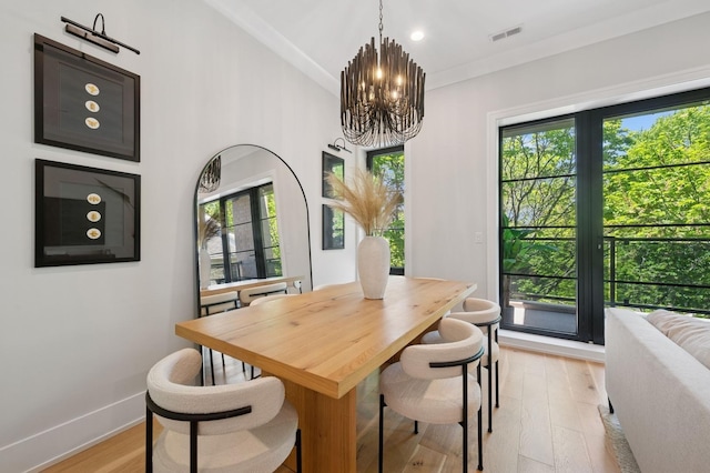 dining space with a chandelier, plenty of natural light, light wood finished floors, baseboards, and recessed lighting