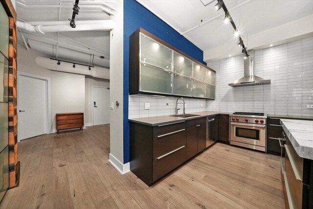 6 S Laflin St Unit 913, Chicago, IL 60607 - kitchen featuring track lighting, appliances with stainless steel finishes, wall chimney range hood, and a sink
