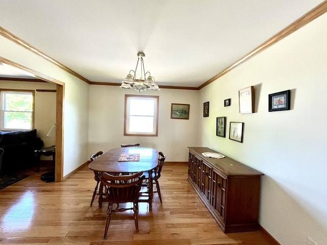 80 N 14th Rd, Lostant, IL 61334 - dining room featuring ornamental molding, healthy amount of natural light, light wood-type flooring, and a chandelier