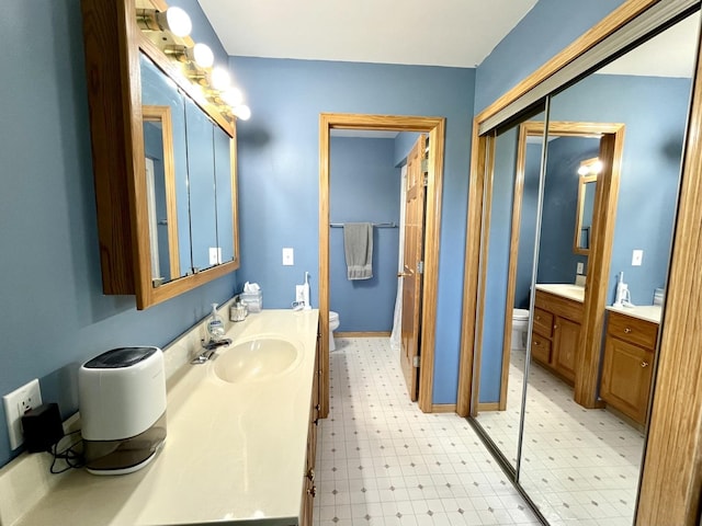 80 N 14th Rd, Lostant, IL 61334 - full bath with toilet, vanity, and tile patterned floors