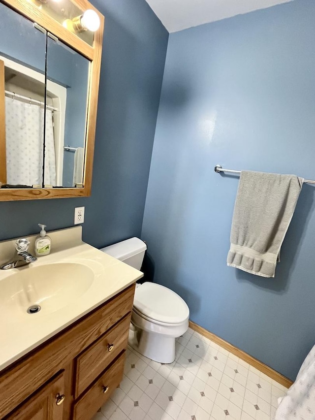 80 N 14th Rd, Lostant, IL 61334 - bathroom with toilet, baseboards, and vanity