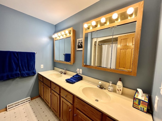 80 N 14th Rd, Lostant, IL 61334 - full bathroom with baseboards, double vanity, tile patterned floors, and curtained shower