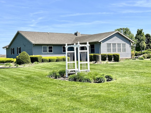 80 N 14th Rd, Lostant, IL 61334 - rear view of property featuring a lawn, a chimney, and a shingled roof