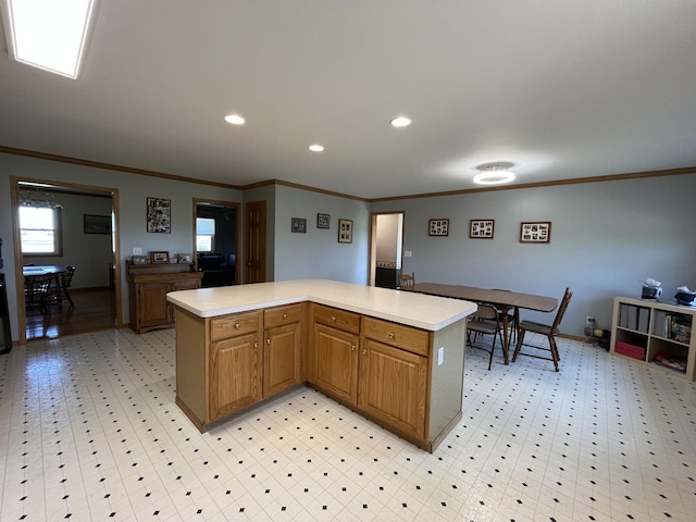 80 N 14th Rd, Lostant, IL 61334 - kitchen with crown molding, light countertops, a kitchen island, light flooring, and recessed lighting