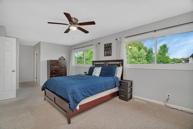 424 Falcon Ridge Way, Bolingbrook, IL 60440 - bedroom featuring baseboards, light colored carpet, and a ceiling fan