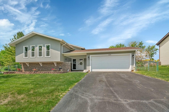 424 Falcon Ridge Way, Bolingbrook, IL 60440 - tri-level home featuring asphalt driveway and an attached garage