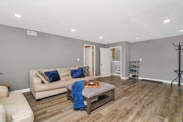 424 Falcon Ridge Way, Bolingbrook, IL 60440 - living area with wood finished floors, recessed lighting, stairs, and baseboards