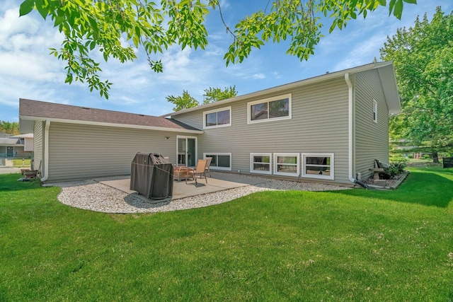 424 Falcon Ridge Way, Bolingbrook, IL 60440 - back of house featuring a patio and a yard