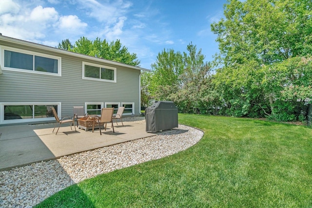 424 Falcon Ridge Way, Bolingbrook, IL 60440 - view of grassy yard with a fire pit and a patio area
