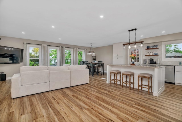 424 Falcon Ridge Way, Bolingbrook, IL 60440 - living room with light wood finished floors, baseboards, and recessed lighting