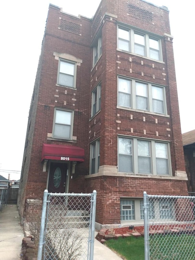 8015 S May St, Chicago, IL 60620 - view of building exterior featuring fence