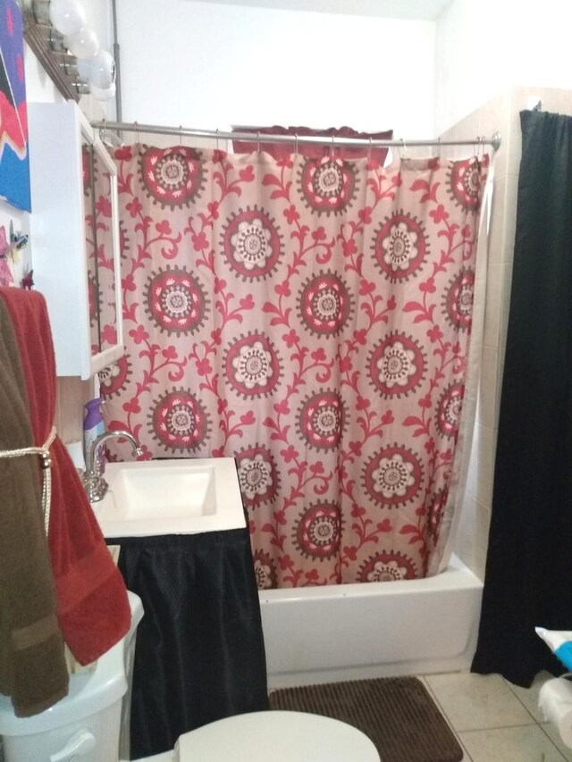 8015 S May St, Chicago, IL 60620 - full bathroom with shower / tub combo, vanity, toilet, and tile patterned floors