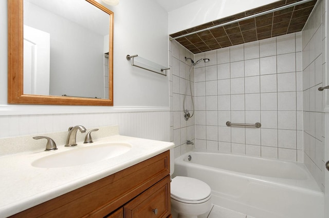 2700 E Bel Aire Dr Unit 304, Arlington Heights, IL 60004 - bathroom with toilet, washtub / shower combination, vanity, and wainscoting