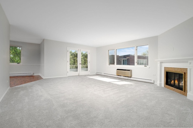 2700 E Bel Aire Dr Unit 304, Arlington Heights, IL 60004 - unfurnished living room featuring carpet floors, a baseboard heating unit, a glass covered fireplace, a wall unit AC, and baseboards