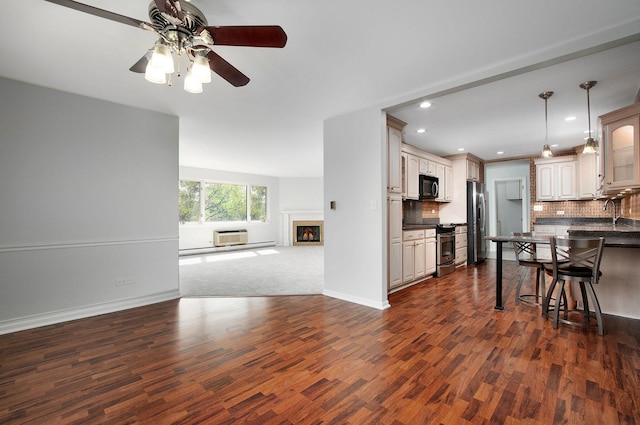 2700 E Bel Aire Dr Unit 304, Arlington Heights, IL 60004 - kitchen with appliances with stainless steel finishes, open floor plan, dark countertops, ceiling fan, and dark wood-type flooring