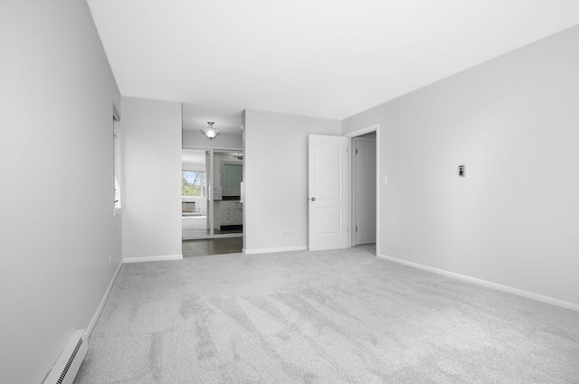 2700 E Bel Aire Dr Unit 304, Arlington Heights, IL 60004 - unfurnished bedroom featuring a baseboard heating unit, carpet flooring, and baseboards