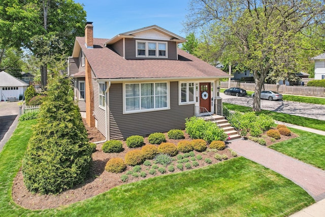 bungalow featuring a chimney and a shingled roof