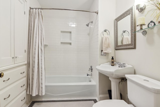 full bathroom featuring toilet, shower / bath combo, and tile patterned flooring