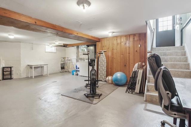 exercise area with wooden walls and heating unit