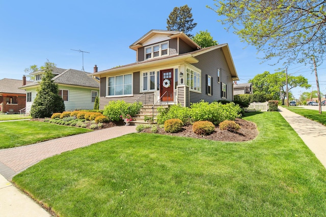 bungalow featuring a front yard