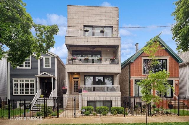 2116 W Barry Ave Unit 3, Chicago, IL 60618 - view of front of property featuring a balcony, a fenced front yard, and a gate