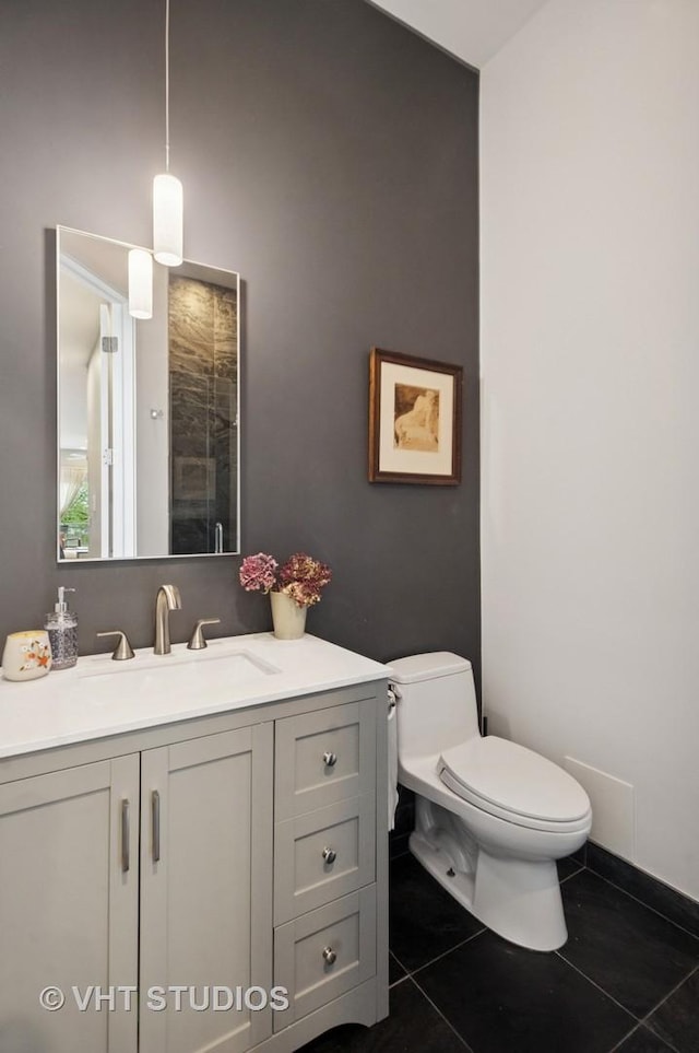 2116 W Barry Ave Unit 3, Chicago, IL 60618 - bathroom featuring tile patterned flooring, vanity, toilet, and tiled shower