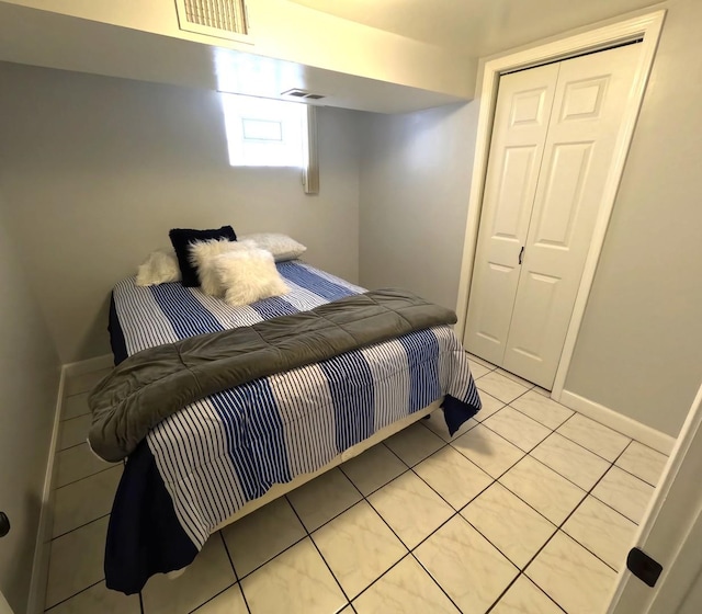 6209 N Nagle Ave, Chicago, IL 60646 - bedroom with light tile patterned floors and baseboards
