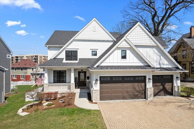 5233 Carpenter St, Downers Grove, IL 60515 - view of front facade with board and batten siding, covered porch, decorative driveway, roof with shingles, and a front lawn
