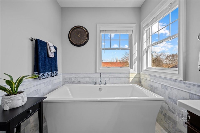 5233 Carpenter St, Downers Grove, IL 60515 - bathroom with tile walls, a freestanding tub, wainscoting, and vanity