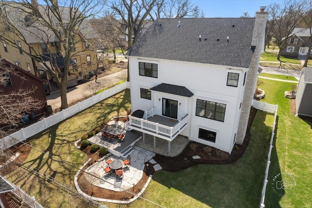 5233 Carpenter St, Downers Grove, IL 60515 - back of house featuring a chimney, a shingled roof, and a patio